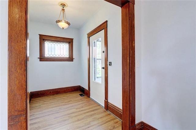 3521 Windsor Ave, Kansas City, MO 64123 - foyer with light wood-style floors and baseboards
