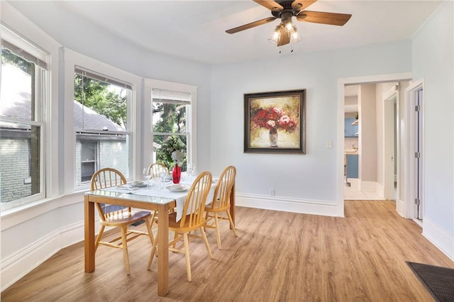 3521 Windsor Ave, Kansas City, MO 64123 - dining space with light wood-type flooring, baseboards, and ceiling fan