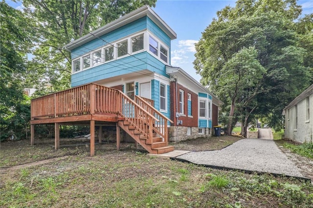 3521 Windsor Ave, Kansas City, MO 64123 - back of house featuring a wooden deck