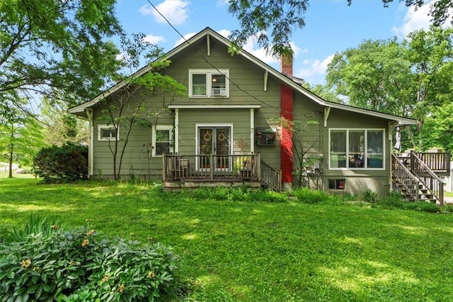 115 Adkins Rd, Glenaire, MO 64068 - rear view of house featuring a chimney, a lawn, stairs, and french doors