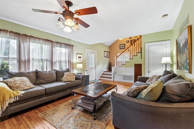 115 Adkins Rd, Glenaire, MO 64068 - living room with stairway, wood-type flooring, a ceiling fan, and lofted ceiling