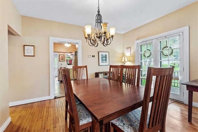 115 Adkins Rd, Glenaire, MO 64068 - dining area featuring light wood-type flooring and a chandelier