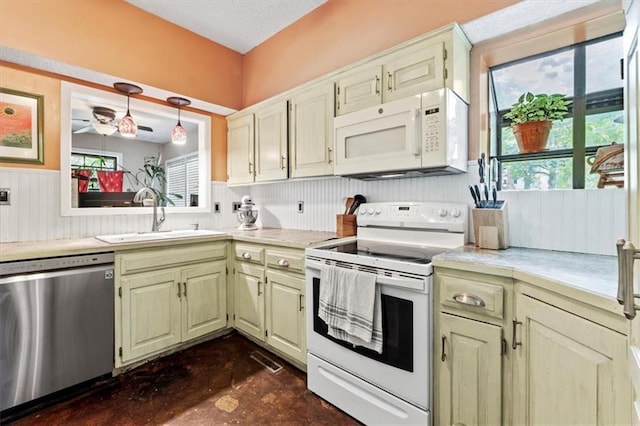 115 Adkins Rd, Glenaire, MO 64068 - kitchen with white appliances, light countertops, a ceiling fan, finished concrete flooring, and hanging light fixtures