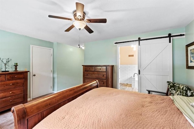 115 Adkins Rd, Glenaire, MO 64068 - bedroom with a barn door, ensuite bath, and ceiling fan