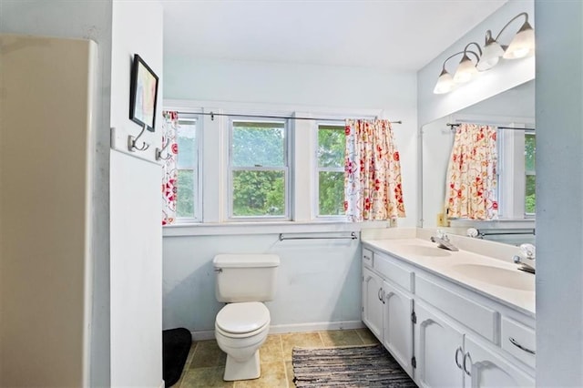 115 Adkins Rd, Glenaire, MO 64068 - bathroom featuring double vanity and tile patterned floors