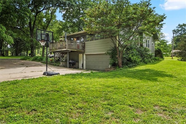 115 Adkins Rd, Glenaire, MO 64068 - view of green lawn featuring a garage, a wooden deck, and driveway