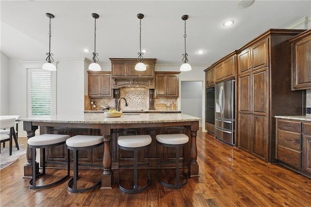 9332 W 158th St, Overland Park, KS 66221 - kitchen featuring stainless steel fridge, dark wood-style flooring, decorative backsplash, light stone countertops, and recessed lighting