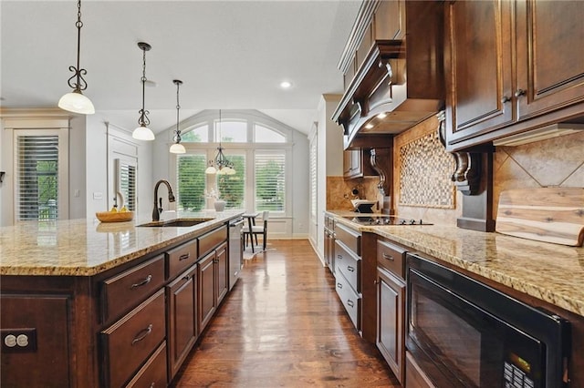 9332 W 158th St, Overland Park, KS 66221 - kitchen with black appliances, dark wood finished floors, light stone countertops, tasteful backsplash, and lofted ceiling