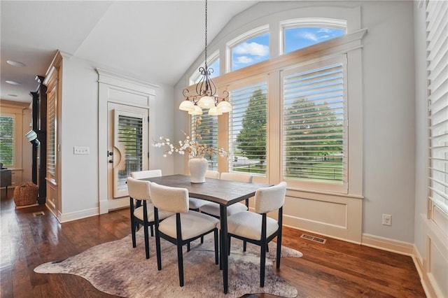 9332 W 158th St, Overland Park, KS 66221 - dining space with wood finished floors, lofted ceiling, and a chandelier