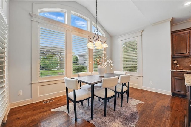 9332 W 158th St, Overland Park, KS 66221 - dining space featuring lofted ceiling and dark wood-type flooring