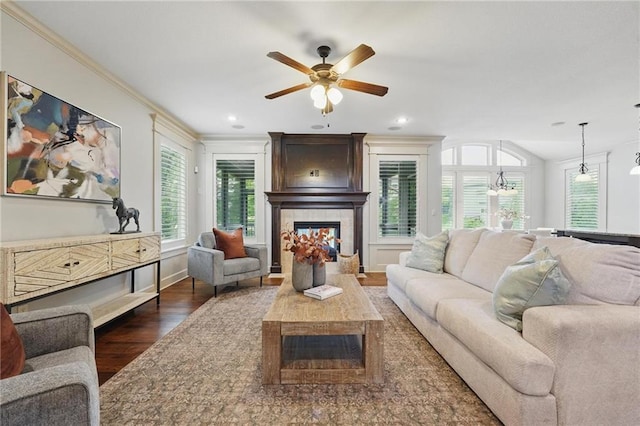 9332 W 158th St, Overland Park, KS 66221 - living room with a tile fireplace, dark wood-type flooring, a ceiling fan, crown molding, and recessed lighting
