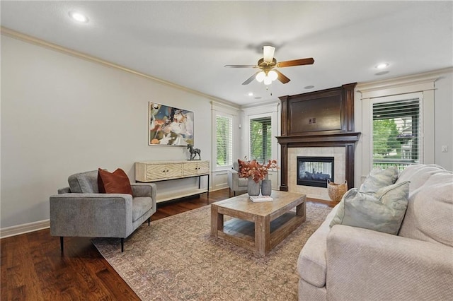 9332 W 158th St, Overland Park, KS 66221 - living room featuring crown molding, a tile fireplace, plenty of natural light, wood finished floors, and a ceiling fan