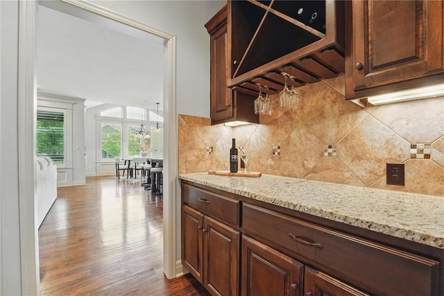 9332 W 158th St, Overland Park, KS 66221 - indoor dry bar featuring dark wood-style flooring and decorative backsplash