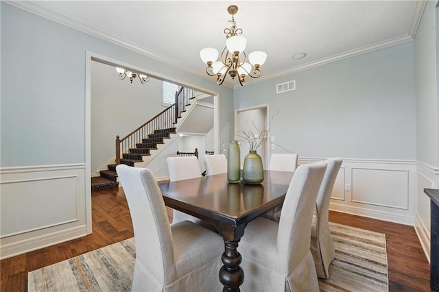 9332 W 158th St, Overland Park, KS 66221 - dining room with a chandelier, stairs, wood finished floors, crown molding, and a wainscoted wall