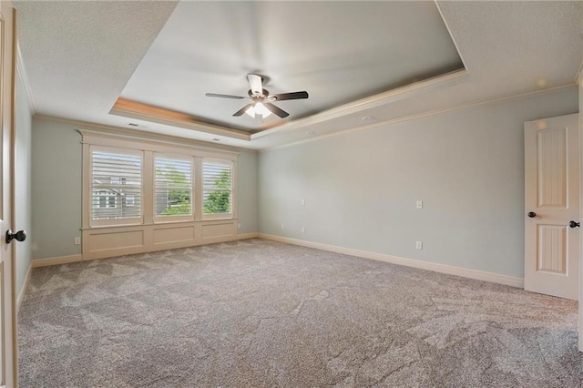 9332 W 158th St, Overland Park, KS 66221 - carpeted spare room with a raised ceiling, ornamental molding, and a ceiling fan