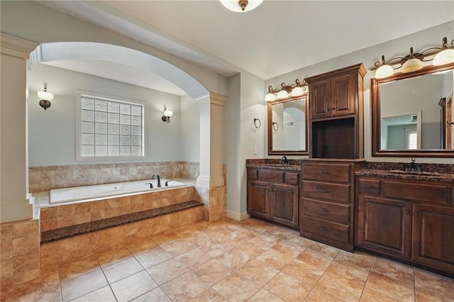 9332 W 158th St, Overland Park, KS 66221 - bathroom with double vanity, a bath, and ornate columns