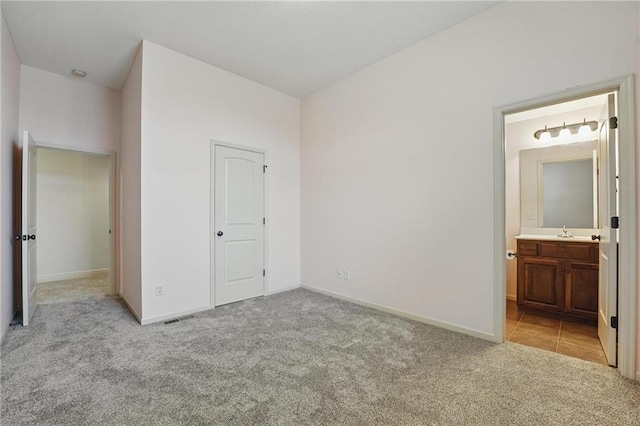 9332 W 158th St, Overland Park, KS 66221 - unfurnished bedroom with light colored carpet and ensuite bath
