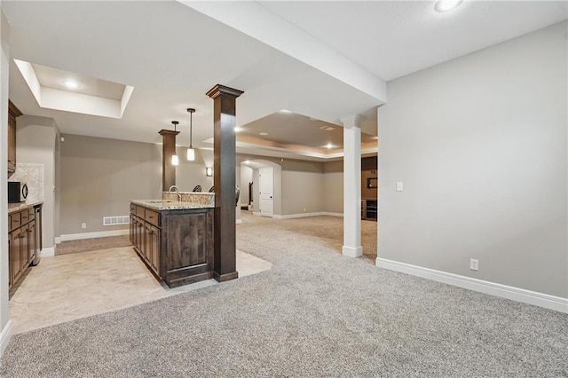 9332 W 158th St, Overland Park, KS 66221 - kitchen featuring a raised ceiling, light colored carpet, arched walkways, ornate columns, and recessed lighting