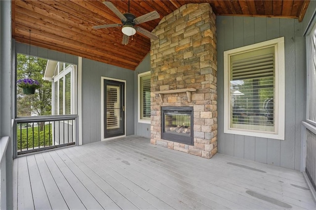 9332 W 158th St, Overland Park, KS 66221 - wooden terrace with an outdoor stone fireplace and ceiling fan