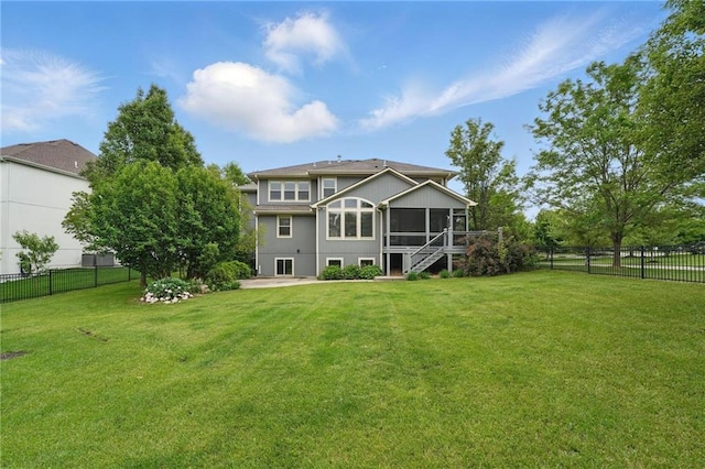9332 W 158th St, Overland Park, KS 66221 - rear view of property featuring a sunroom, a fenced backyard, and stairway