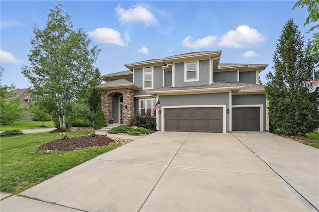 9332 W 158th St, Overland Park, KS 66221 - prairie-style home with a garage, driveway, stucco siding, and a front lawn