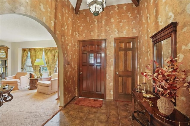 8206 Parkhill Cir, Lenexa, KS 66215 - tiled entryway featuring arched walkways and carpet