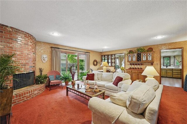 8206 Parkhill Cir, Lenexa, KS 66215 - living room with carpet flooring, a textured ceiling, a fireplace, and recessed lighting