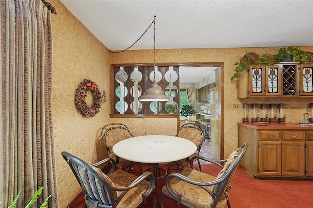8206 Parkhill Cir, Lenexa, KS 66215 - carpeted dining room featuring bar and vaulted ceiling