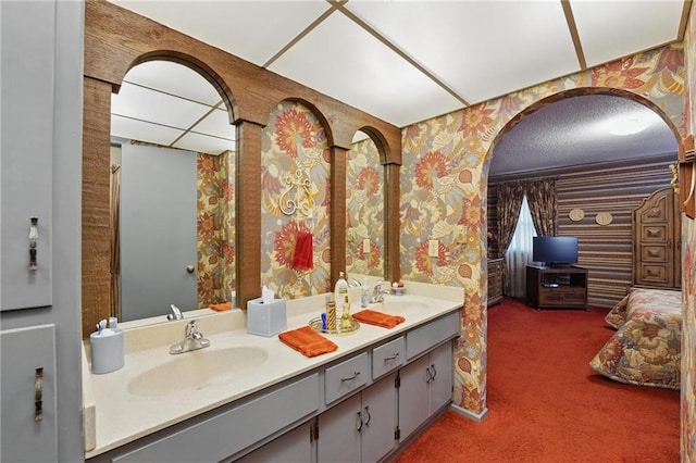 8206 Parkhill Cir, Lenexa, KS 66215 - bathroom featuring wallpapered walls and double vanity