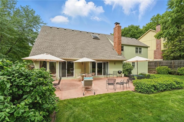8206 Parkhill Cir, Lenexa, KS 66215 - back of property featuring roof with shingles, a chimney, and a patio