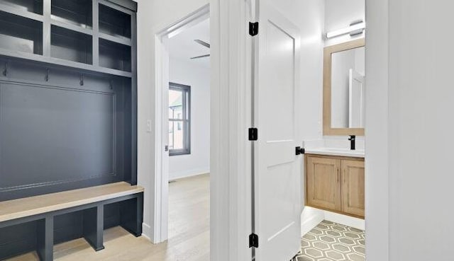 22076 W 99th Ter, Lenexa, KS 66220 - mudroom featuring a sink and baseboards