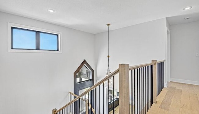 22076 W 99th Ter, Lenexa, KS 66220 - hallway with wood finished floors, an upstairs landing, baseboards, and recessed lighting