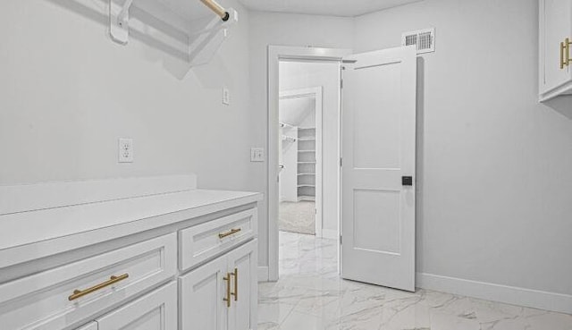 22076 W 99th Ter, Lenexa, KS 66220 - corridor with light marble finish flooring and baseboards