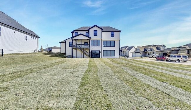 22076 W 99th Ter, Lenexa, KS 66220 - rear view of property with stairs, a residential view, and a lawn