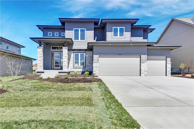 21901 W 99th Ter, Lenexa, KS 66220 - prairie-style home featuring stone siding, driveway, a front yard, and an attached garage