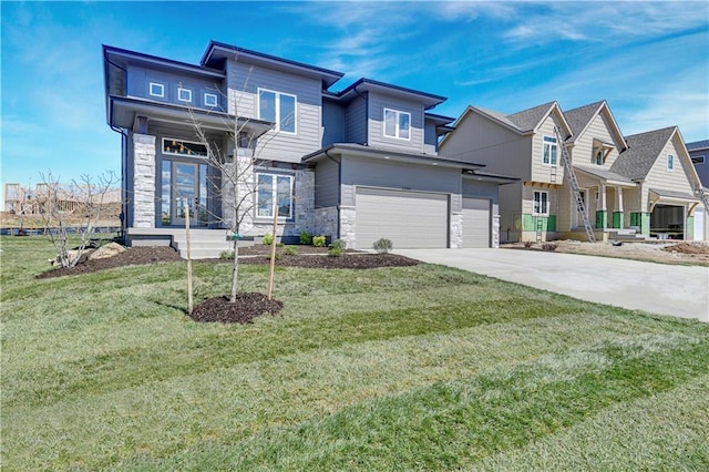 21901 W 99th Ter, Lenexa, KS 66220 - view of front of house with stone siding, an attached garage, concrete driveway, and a front lawn