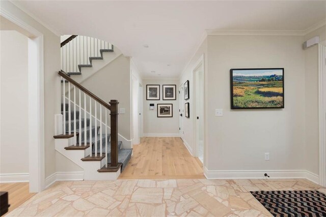 8311 Wenonga Rd, Leawood, KS 66206 - foyer featuring stairway, wood finished floors, and ornamental molding