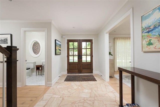 8311 Wenonga Rd, Leawood, KS 66206 - foyer entrance with light wood-type flooring, french doors, and crown molding