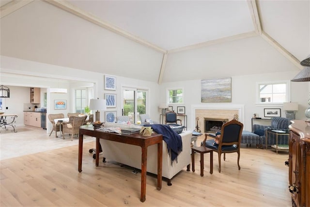 8311 Wenonga Rd, Leawood, KS 66206 - living room with a fireplace, high vaulted ceiling, and light wood-type flooring