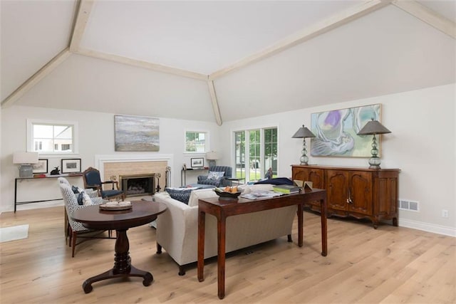 8311 Wenonga Rd, Leawood, KS 66206 - living room with beam ceiling, a fireplace, light wood-style floors, and high vaulted ceiling