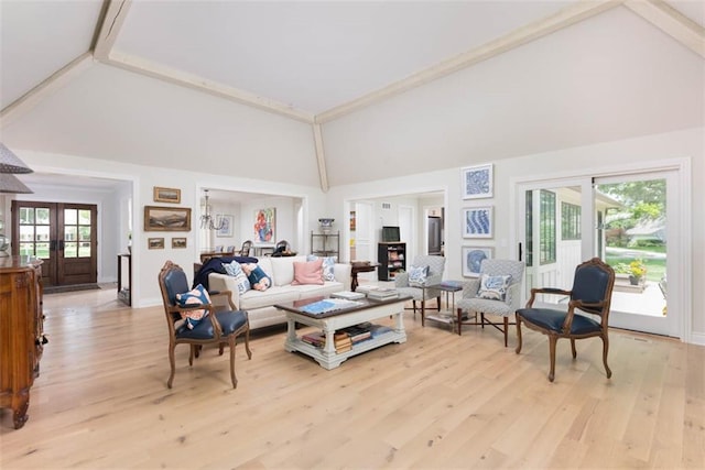 8311 Wenonga Rd, Leawood, KS 66206 - living room with high vaulted ceiling, french doors, and light wood finished floors