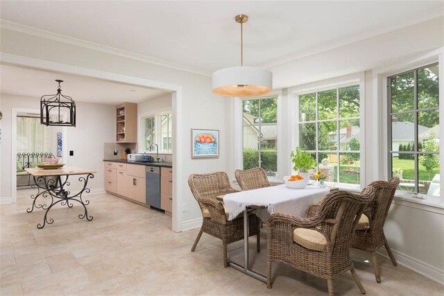 8311 Wenonga Rd, Leawood, KS 66206 - dining space featuring crown molding and a chandelier