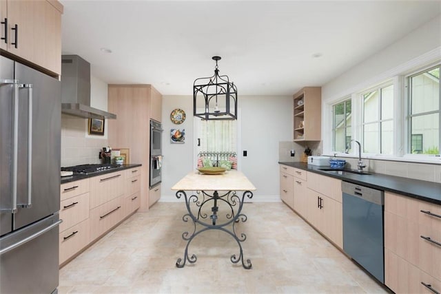 8311 Wenonga Rd, Leawood, KS 66206 - kitchen featuring appliances with stainless steel finishes, wall chimney range hood, light brown cabinets, backsplash, and dark countertops