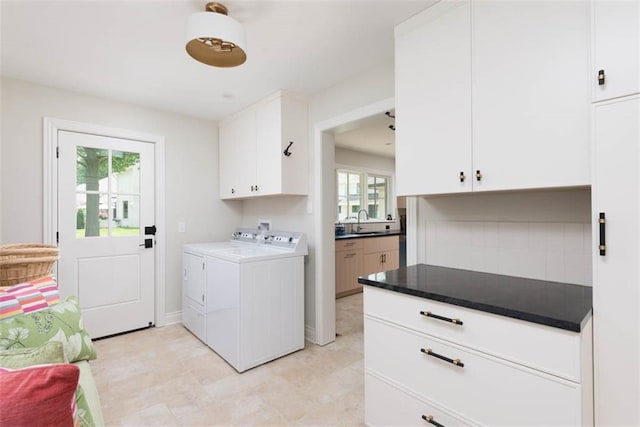 8311 Wenonga Rd, Leawood, KS 66206 - laundry room featuring cabinet space and independent washer and dryer