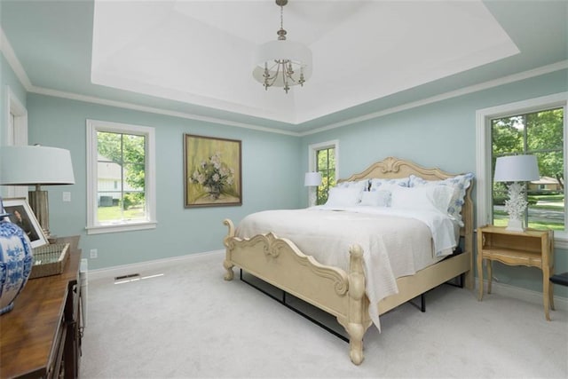 8311 Wenonga Rd, Leawood, KS 66206 - bedroom featuring a raised ceiling, multiple windows, carpet, a chandelier, and crown molding