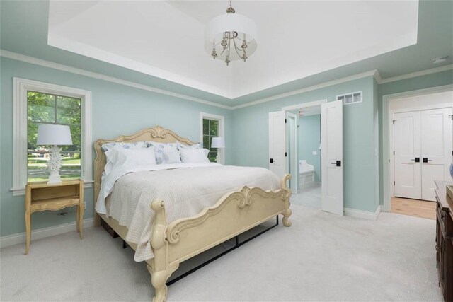 8311 Wenonga Rd, Leawood, KS 66206 - carpeted bedroom with a raised ceiling, a chandelier, ornamental molding, and ensuite bath