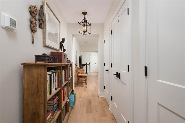 8311 Wenonga Rd, Leawood, KS 66206 - hallway with light wood-style floors