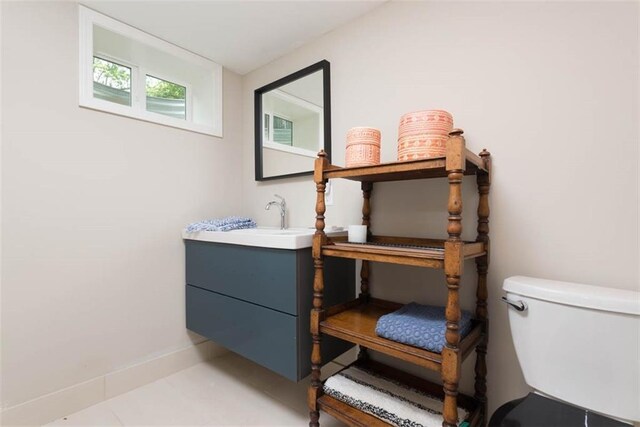 8311 Wenonga Rd, Leawood, KS 66206 - half bath featuring vanity and tile patterned floors