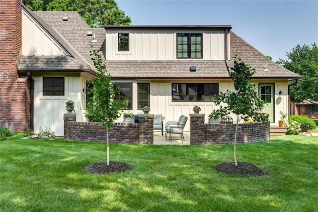 8311 Wenonga Rd, Leawood, KS 66206 - back of house featuring board and batten siding, a shingled roof, a yard, a patio area, and a chimney
