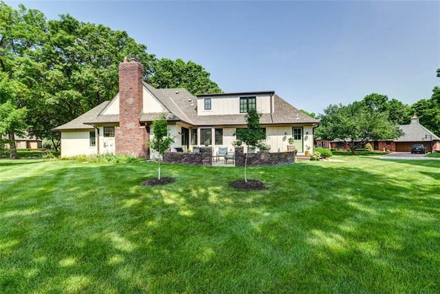 8311 Wenonga Rd, Leawood, KS 66206 - back of property featuring a chimney and a lawn